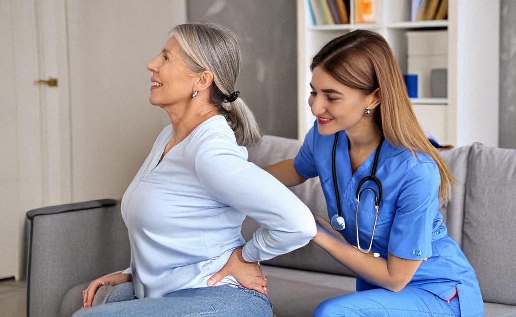 nurse with patient experiencing back pain
